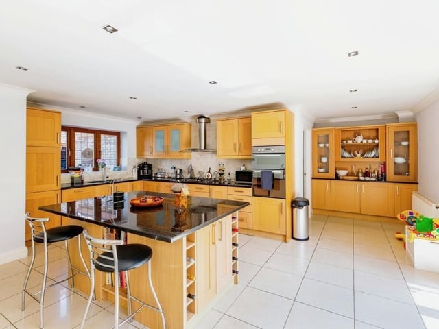 The kitchen is designed to be a sociable living space, with plenty of room for entertaining guests and other household members