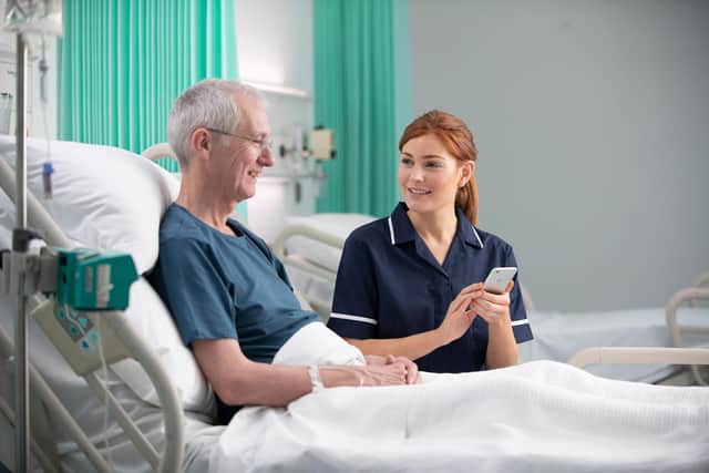 Staff may use secure hospital-owned portable devices to access patient information while at their bedside. Photocredit Nervecentre.