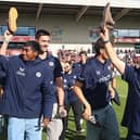 Shoes off if you love the town... Darren Lehmann and the Steelbacks squad enjoyed their lap of honour at Sixfields on Saturday (Picture: Pete Norton/Getty Images)