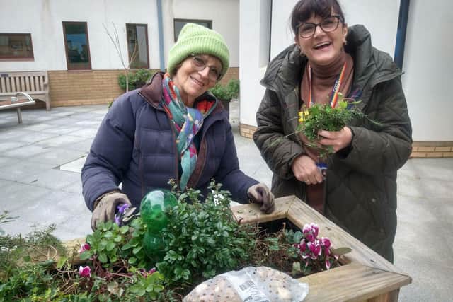 Maria Summerscale (Long Buckby & District Gardening Club) and Odette Douglas (Berrywood Hospital) pruning perennials.