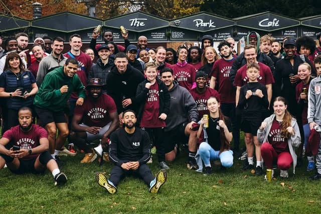 The runners are all smiles after completing the 5k course at Abington Park