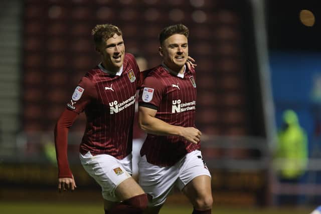 Sam Hoskins runs away to celebrate the first of his goals against Leyton Orient at Sixfields (Picture: Pete Norton)