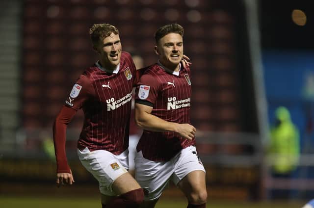 Sam Hoskins runs away to celebrate the first of his goals against Leyton Orient at Sixfields (Picture: Pete Norton)