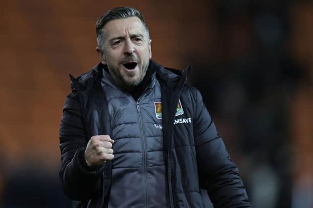 Jon Brady fist pumps after full-time on Tuesday.