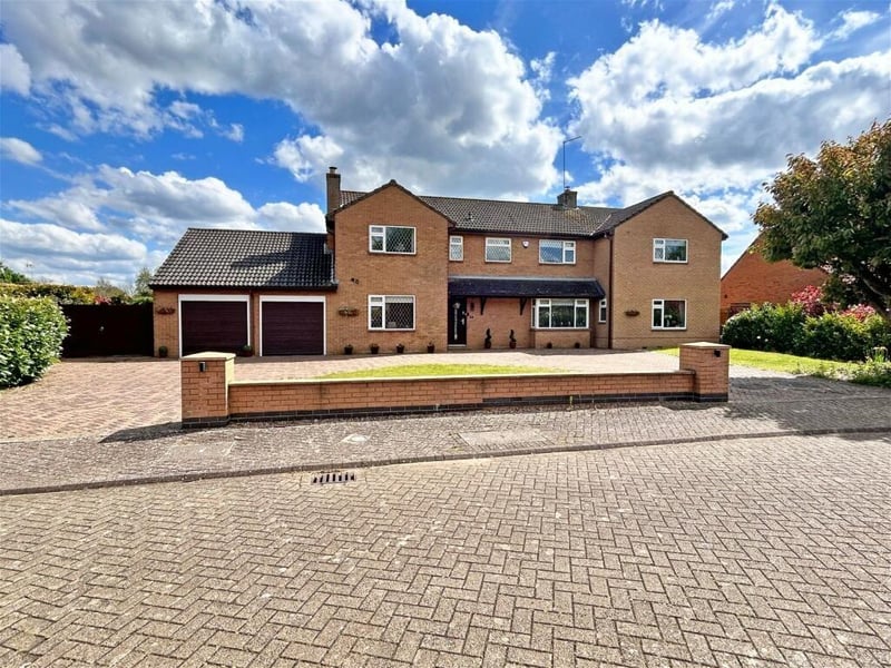 The property makes a grand impression with a sweeping driveway