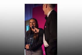 Restaurant worker Alana Ricketts receiving her Unsung Hero Award
