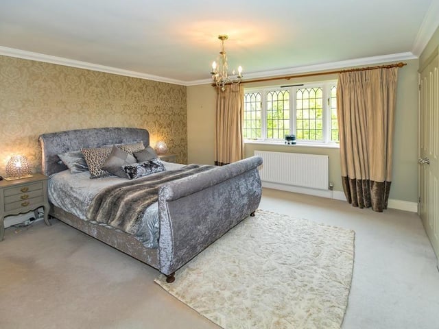 This large double bedroom is one of five inside the property and comes with fitted wardrobes