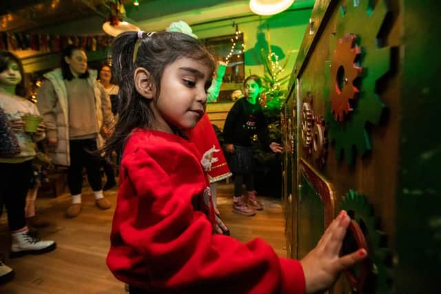 Child using the magic machine