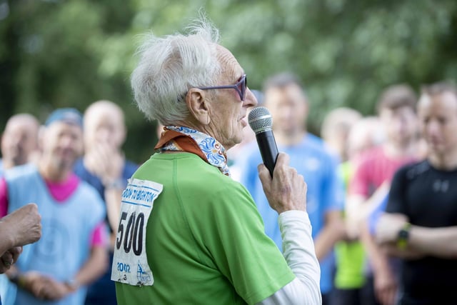 The 90-year-old was met by hundreds of people cheering him on as he reached the milestone at the Racecourse.