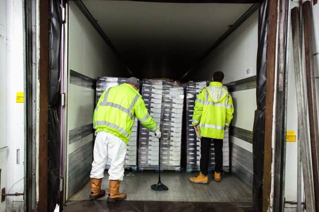 Oakland International inspects a distress load.