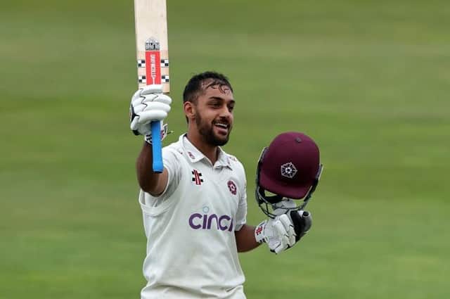 A delighted Saif Zaib celebrates his century for Northants against Surrey at the County Ground