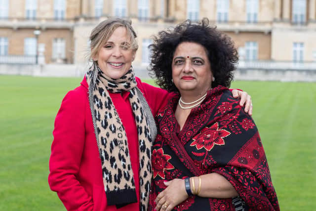 Mel Giedroyc and Neelam Aggarwal in the gardens of Buckingham Palace.