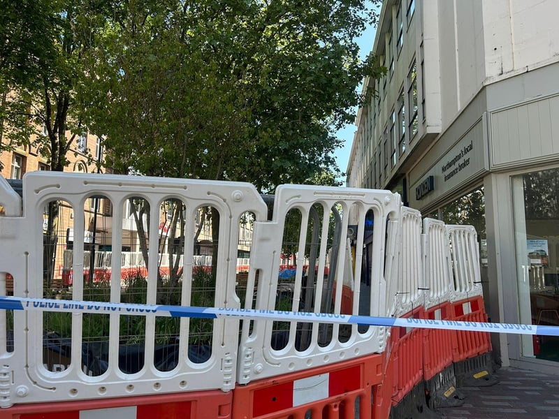 Abington Street is cordoned off from the Market Square to Specsavers.