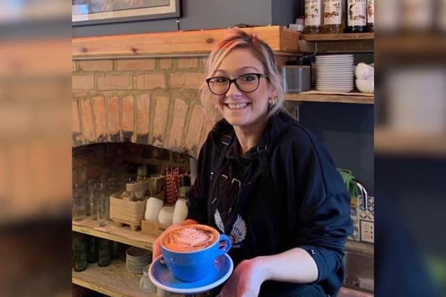 Jayne Catherine, known as the Latte Lady, is a barista at Lawrence's Coffeehouse.