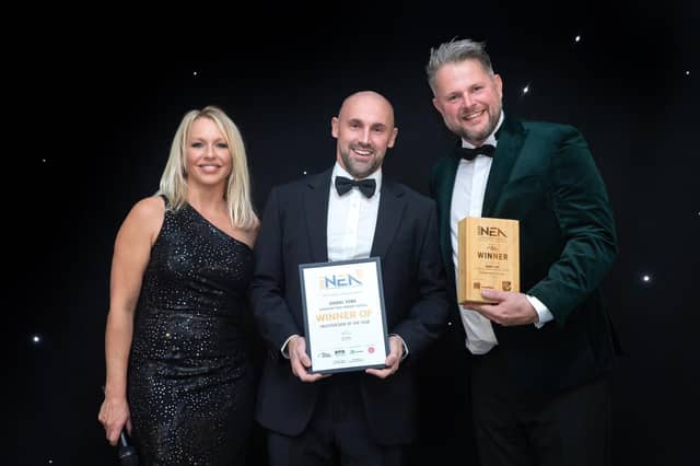 Dan (centre) receives his Headteacher of the Year award