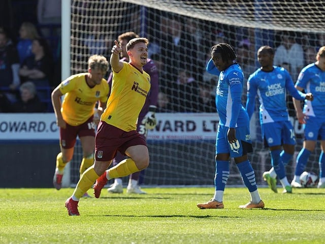 Sam Hoskins wheels away after giving Cobblers the lead