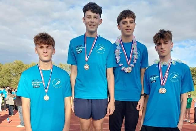 The R&N Under-16 B 4x300m relay team show off their medals