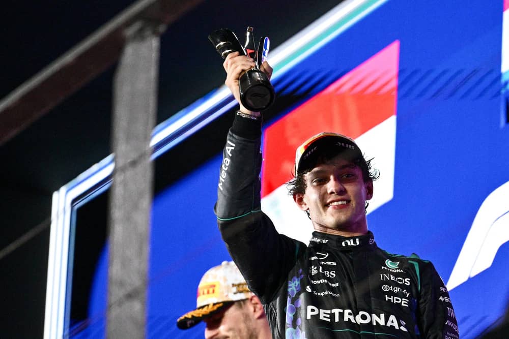 Kimi Antonelli celebrates his third-placed finish at the Singapore Grand Prix. (Photo by ANTHONY WALLACE / AFP via Getty Images)
