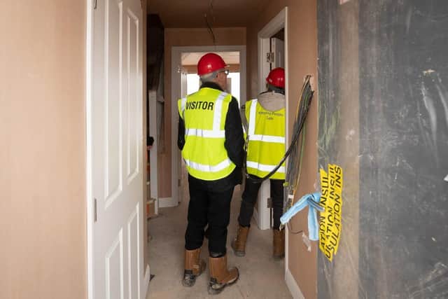 B&DWC - 028 (002) - Visitors walking around a Barratt home at a Hard Hat event