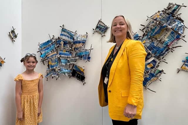 Raygan Marais and Joanne Fennelly from Simon de Senlis Primary School with some of that school's multimedia artwork.