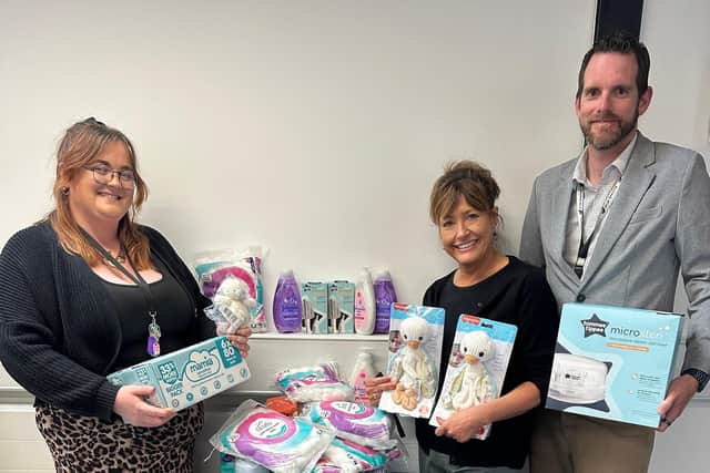 (L-R) Sian Richardson, Gail Haddon and Garrick Hurter of Vulcan Works with just some of the donations for Baby Basics Northampton