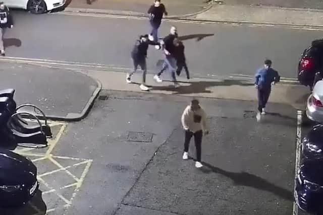 Police have released CCTV footage of men they would like to speak to after an assault outside a Northampton shisha bar.
