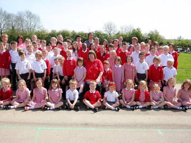 2009: Judy Webster, caretaker at Hartwell Primary School, with pupils and staff from the school, she is a finalist in the term-time education awards unsung hero category.