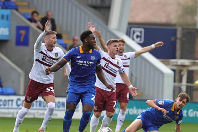 Cobblers player appeal for a foul during Saturday's game against Shrewsbury. Picture: Pete Norton