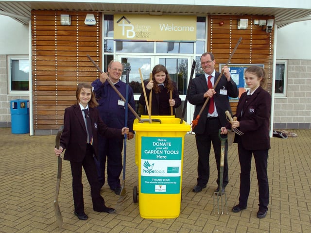Thomas Becket School, Northampton, garden tools collected by pupils for Hope Centre part of hopetools project L-r Alicia Solazzo, 11, Mr Hugh Billingham (teacher), Shannon Gaughran, 12, Paul Gardiner (Principal), Isabelle Benstead, 12