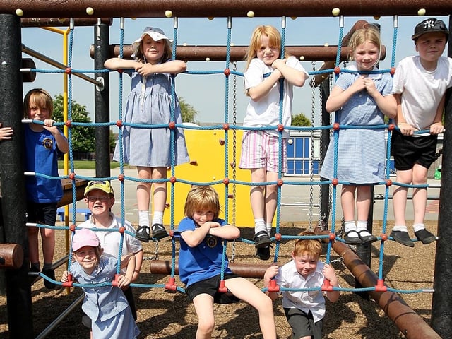 Pupils from Yardley Gobion Primary School playing on their outdoor equipment.