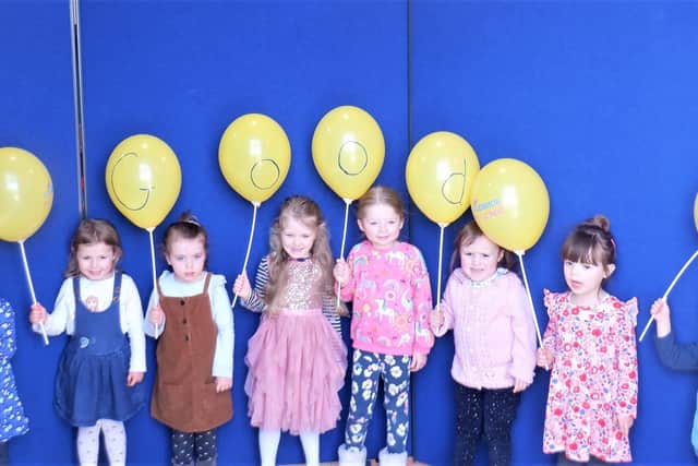 Cogenhoe Preschool children celebrate their good Ofsted rating.