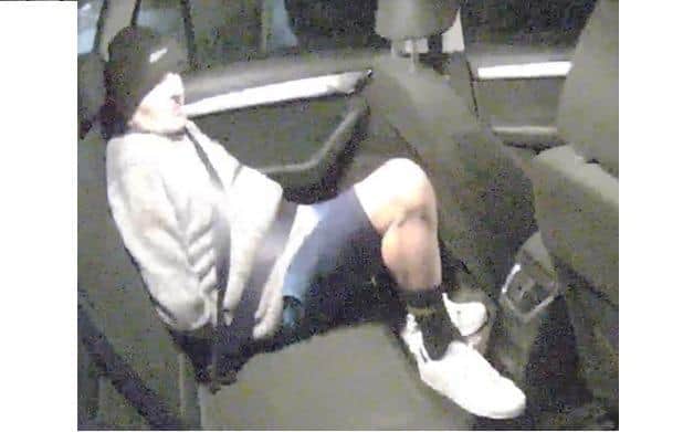 Burglar Michael Clarke in the back of a police car after being arrested in Wellingborough/Northants Police
