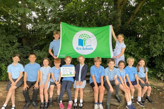Hardingstone Academy's eco-committee with their Eco Schools Green Flag distinction award
