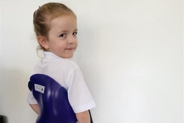Isla Cartwright dressed in one of her brother Harry's old spinal braces to raise money for Children in Need and honour her sibling who was told at two months old that he never walk, but has learnt how to with sheer determination.
