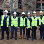 Housing Minister Lee Rowley (fourth from left) is pictured on a visit to a building site at New Southbridge Road in Northampton to launch the final round of the Brownfield Land Release Fund 2. Photo: Northampton Partnership Homes.