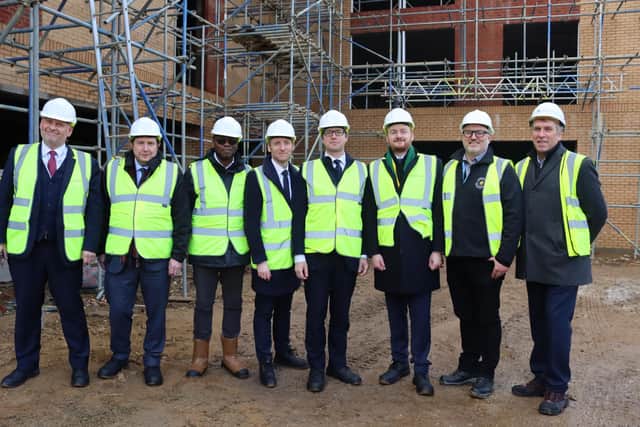 Housing Minister Lee Rowley (fourth from left) is pictured on a visit to a building site at New Southbridge Road in Northampton to launch the final round of the Brownfield Land Release Fund 2. Photo: Northampton Partnership Homes.