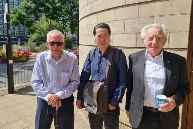 Andy (left) and son Paul (middle) alongside supporter John