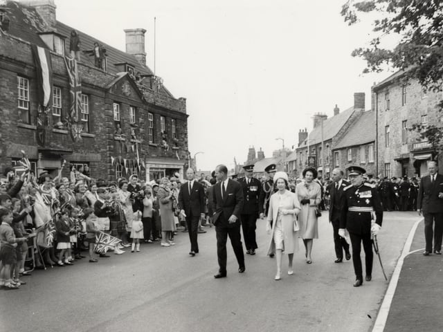 The Queen and Duke of Edinburgh walk through Higham Ferrers during their trip to Northamptonshire on July 9, 1965