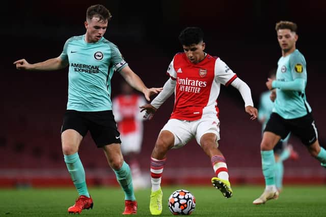 Marc Leonard tussles with Arsenal's Salah Oulad M'Hand in a Premier League 2 clash at the Emirates