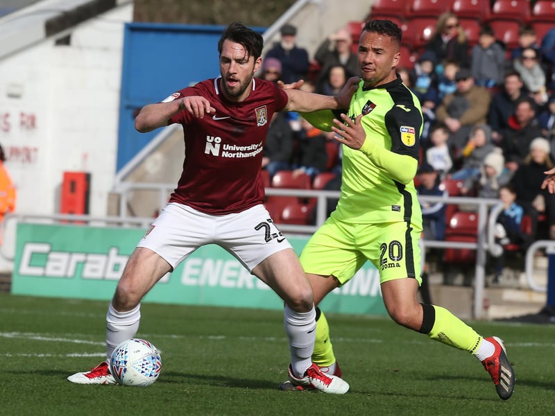 John-Joe O'Toole of Northampton Town controls the ball under pressure from Kane Wilson of Exeter City during the Sky Bet League Two match between Northampton Town and Exeter City at PTS Academy Stadium on March 09, 2019 in Northampton, United Kingdom. (Photo by Pete Norton/Getty Images)