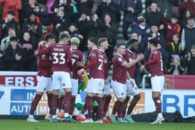 The Cobblers players celebrate after Sam Hoskins opened the scoring against Wigan Athletic at Sixfields (Picture: Pete Norton/Getty Images)
