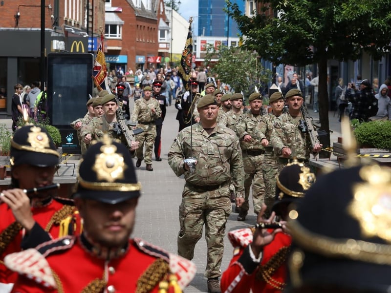 Kettering town centre: crowds line town centre to welcome The Royal Anglian Regiment for Armed Forces Day parade /National World