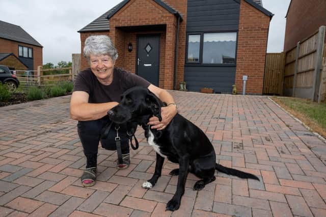 Jeanette and Holly outside their new bungalow in Lilbourne