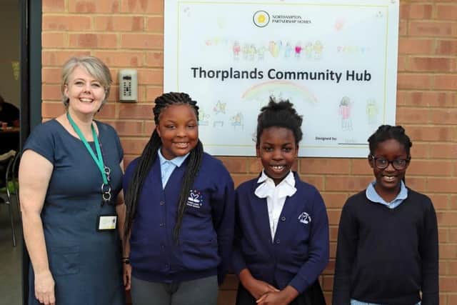 Anna Thorpe, NPH resident involvement officer, and Rinah, Elodea and Utseoritsela from Thorplands Primary School.