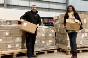 Lee and Lorraine Lewis sorting Avon UK's epic donation