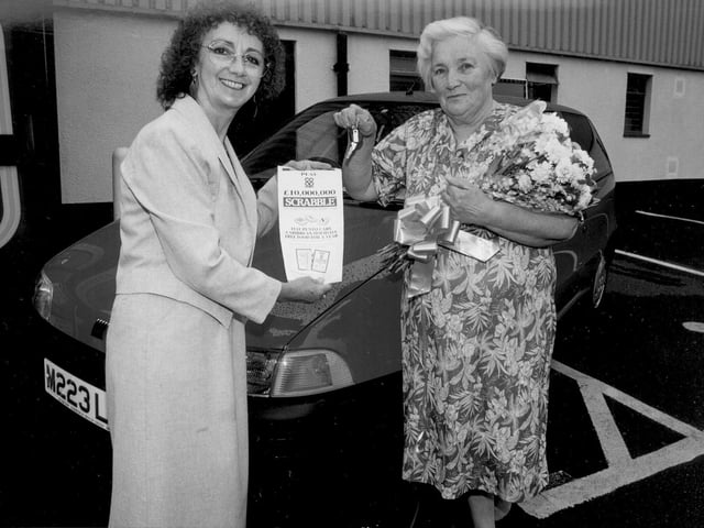 Jane Percival presents car to Pat Bradshaw at st James Co-op 1994