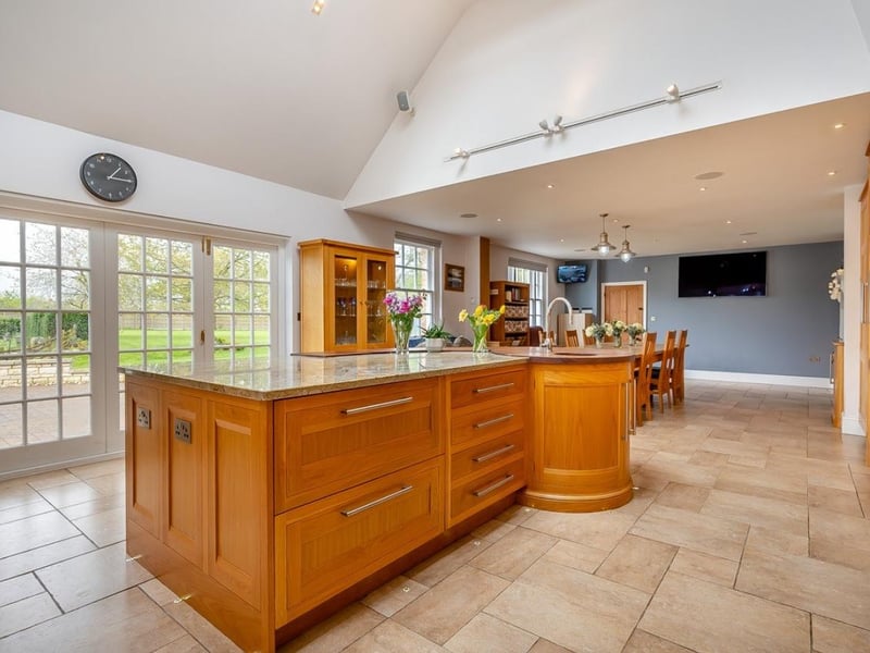 The kitchen is bright and airy with views across the garden