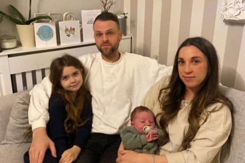 Kirah and Jonathan Green, their eight-year-old daughter Mia, and newborn son Hudson.