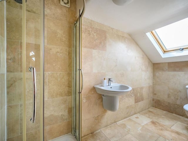 This Victorian home has a tennis court, huge gardens and a private mooring on the River Nene.