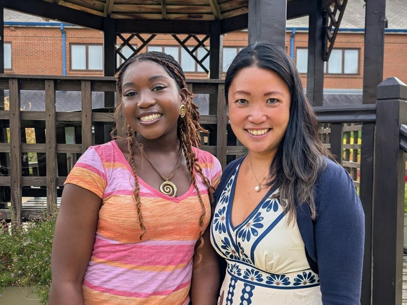 Northampton High School student Aiyven smiles proudly with Dr Lee after receiving her results